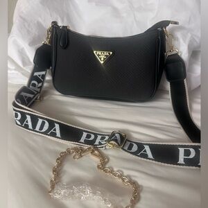 Luxury black leather bag with logo strap